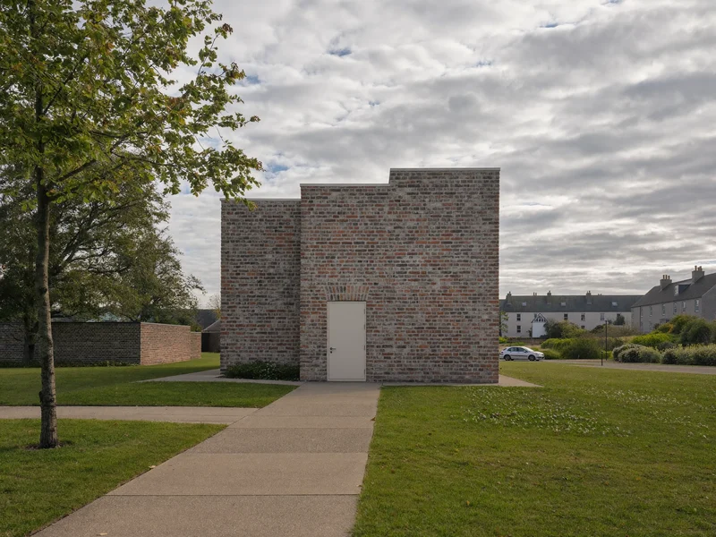 Illustration of a modest brick community building on a residential Bristol square